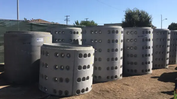 drywell pipe await installation; holes allow water to recharge groundwater supplies via LA County PW
