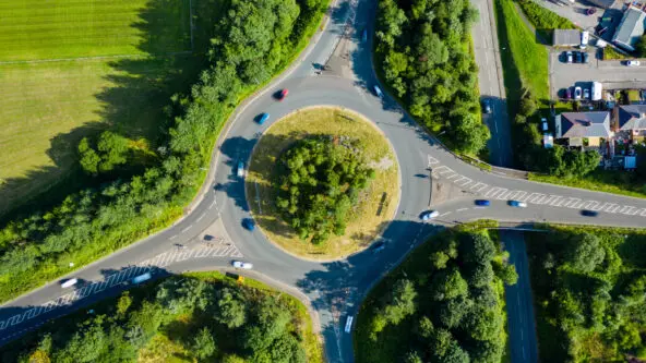 aerial photo of traffic at roundabout, green infrastructure captures rain storm water runoff