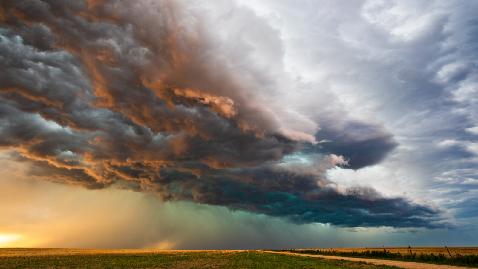 colorful storm clouds over a field