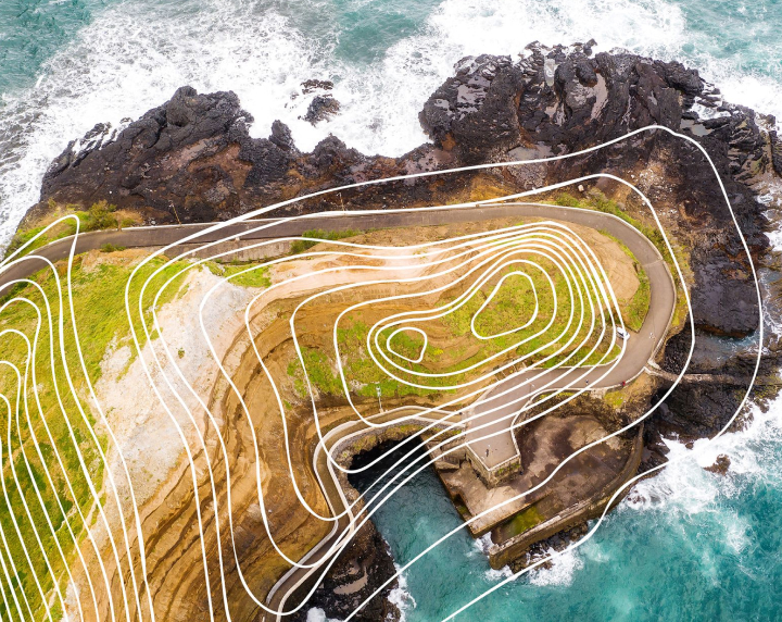 aerial photo of an island with topographic lines, part of KISTERS datasphere design aesthetic 1.0