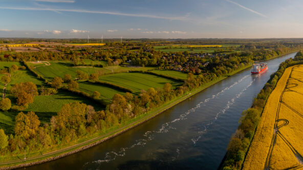 photo rural area with river in foreground