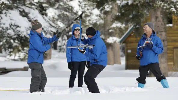 4 Dept. of Water Resources staff at Phillips Station take a manual snow survey on 3 Jan 2023