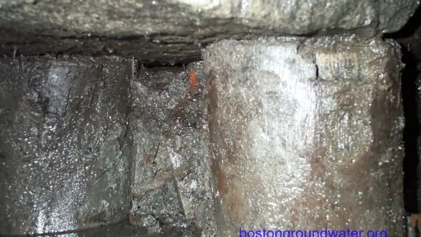 low groundwater levels make old wood pilings below historical building in Boston vulnerable to decay