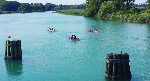 photo of three kayaks on the Antler River in Ontario, Canada