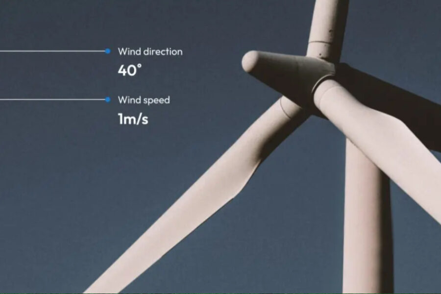 photo of a wind turbine with an upshot angle; data callouts for