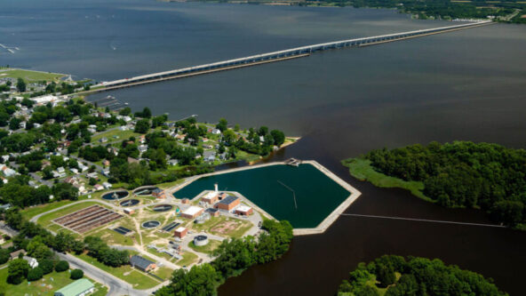 photo of Chesapeake Bay with wastewater treatment plant in teh foreground | photo credit Will Parson, Chesapeake Bay Program