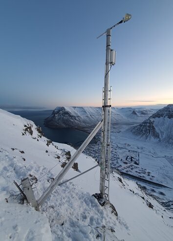 High-altitude installation of the USH-9 snow sensor in alpine mountains.
